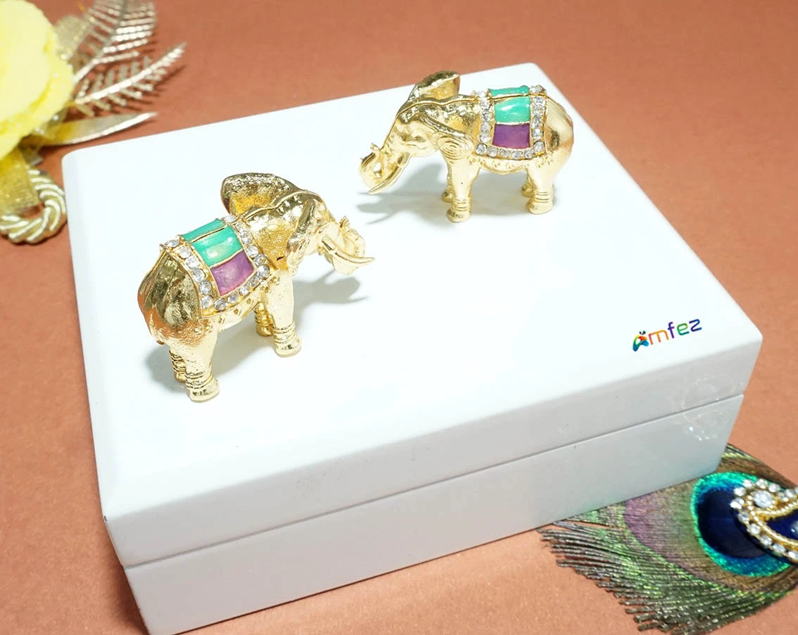 A Pair of Golden Meenakari Work Alloy Elephant Toy